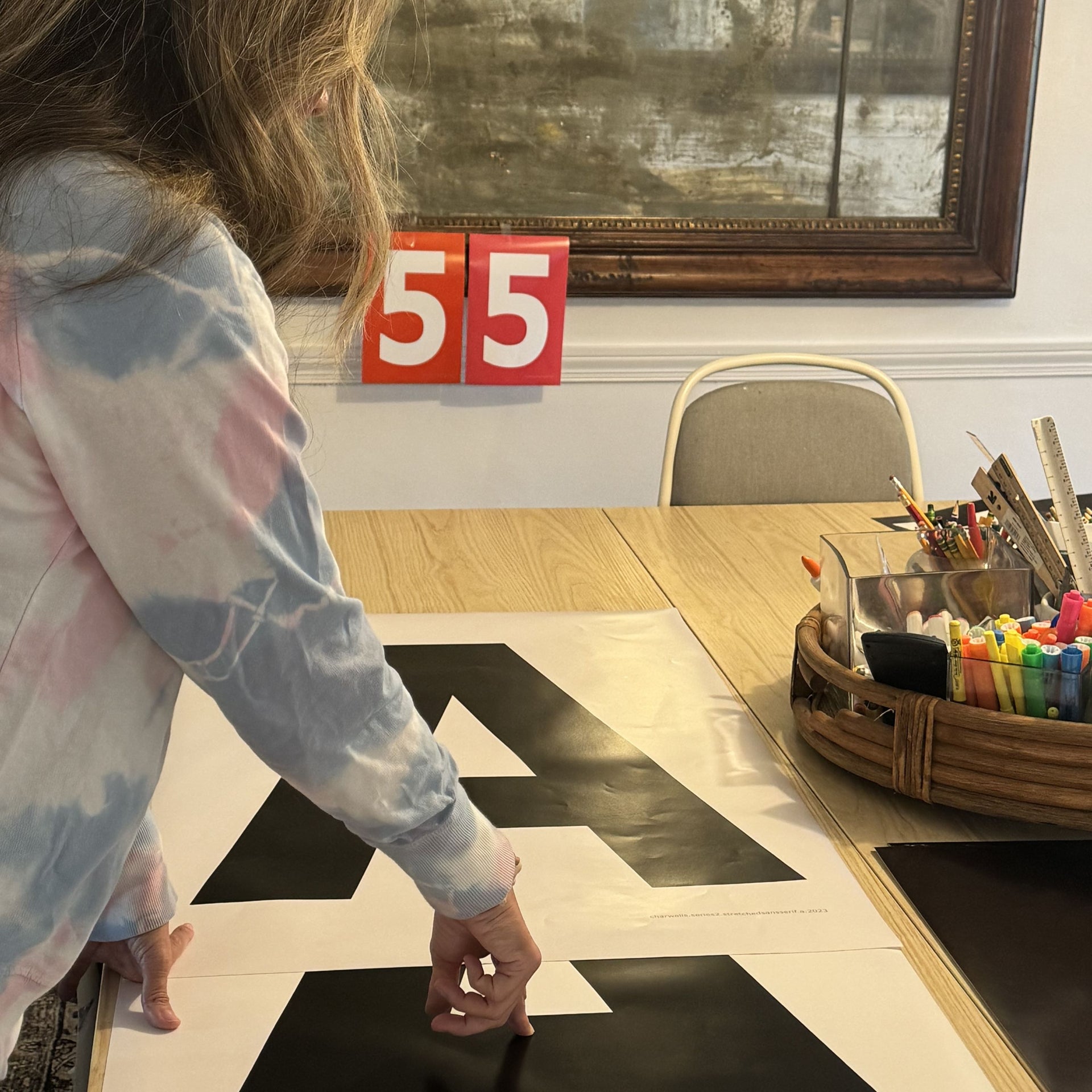 editing letter A art print at the Nantucket studio