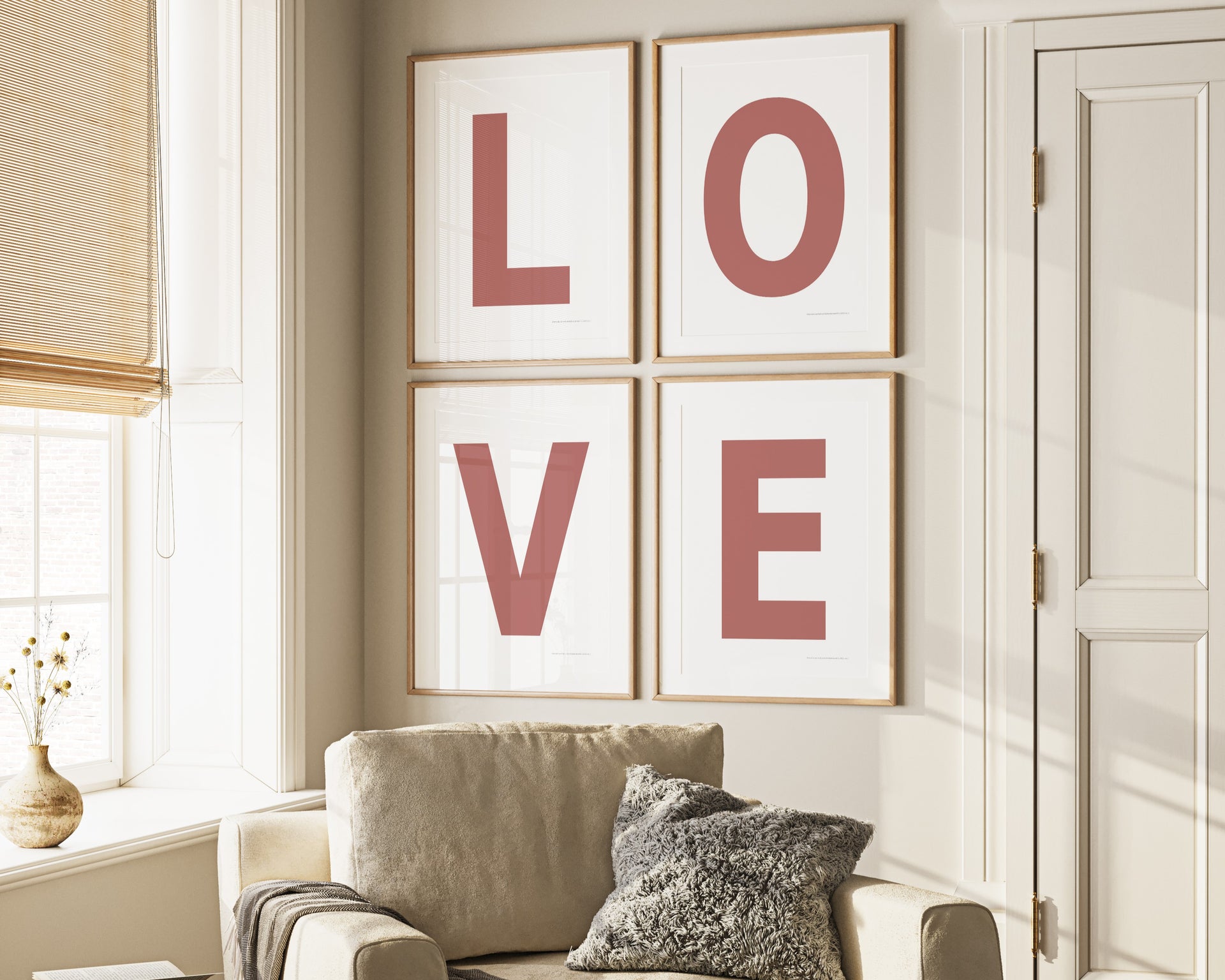 Four framed Nantucket red and white letter art prints spelling out LOVE hanging on wall in living room.