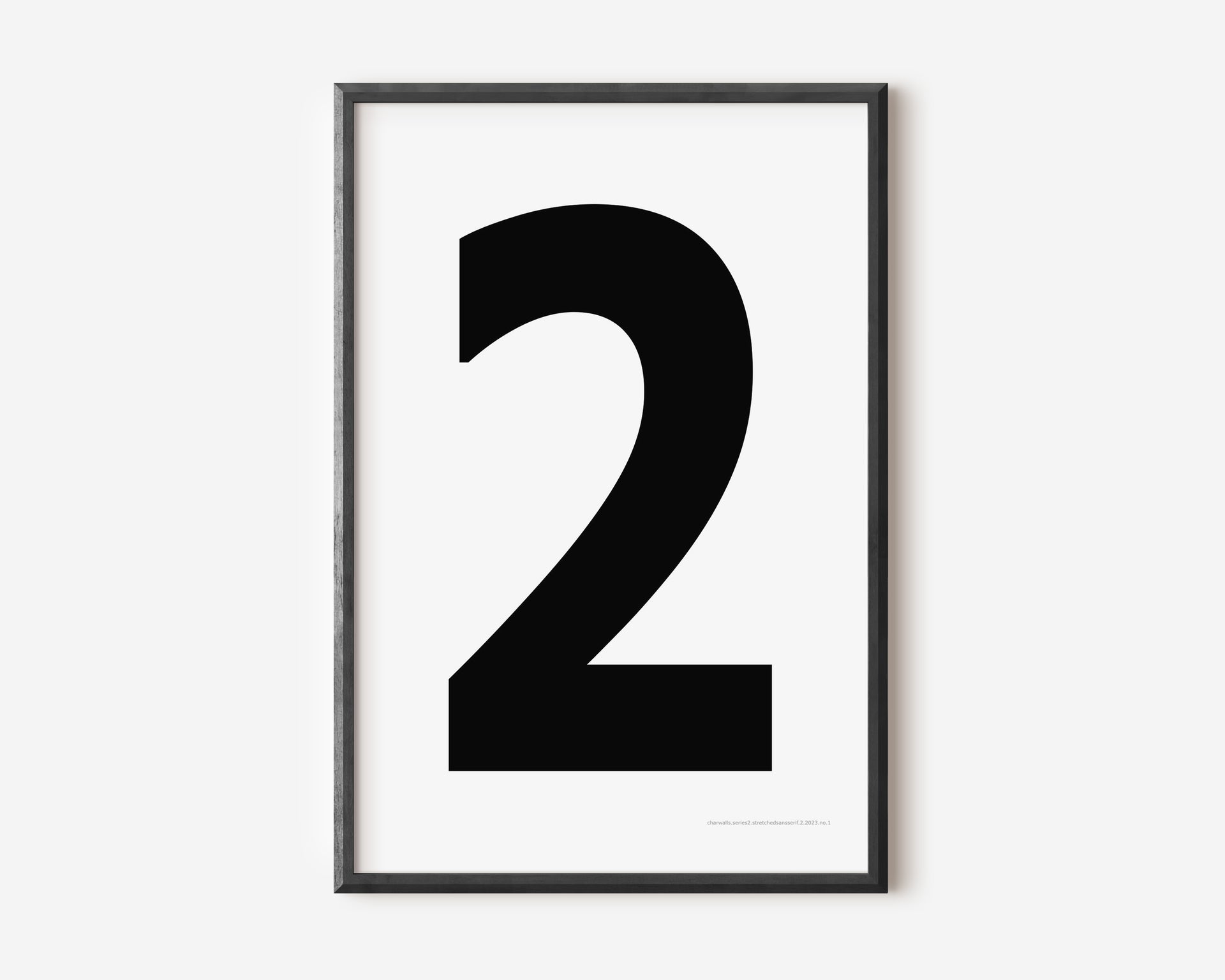 Modern number 2 art print with a black two on a white background.