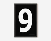 Modern number 9 art print with a white nine on a black background.