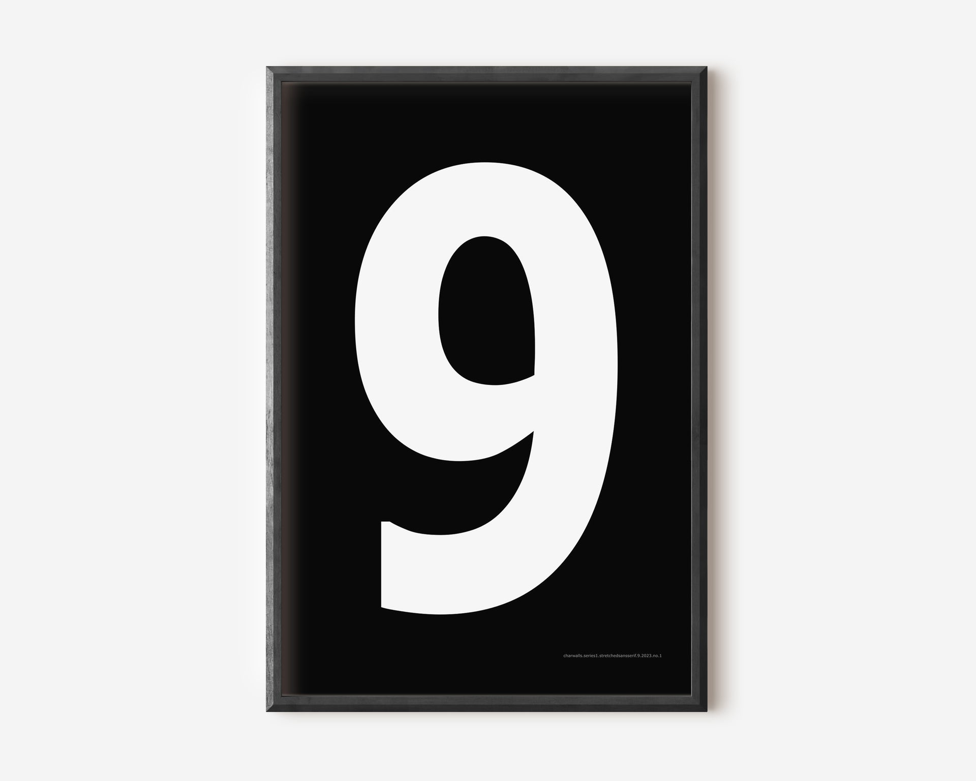 Modern number 9 art print with a white nine on a black background.