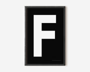 Modern art print with an uppercase white letter F on a black background.