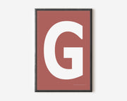 Modern art print with an uppercase white letter G on a Nantucket red background.
