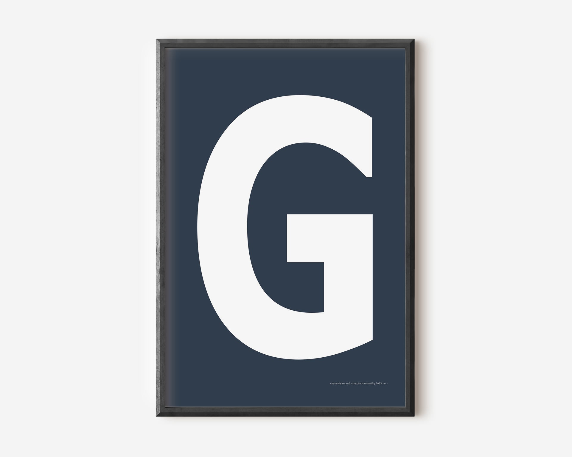Modern art print with an uppercase white letter G on a navy blue background.