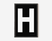 Modern art print with an uppercase white letter H on a black background.