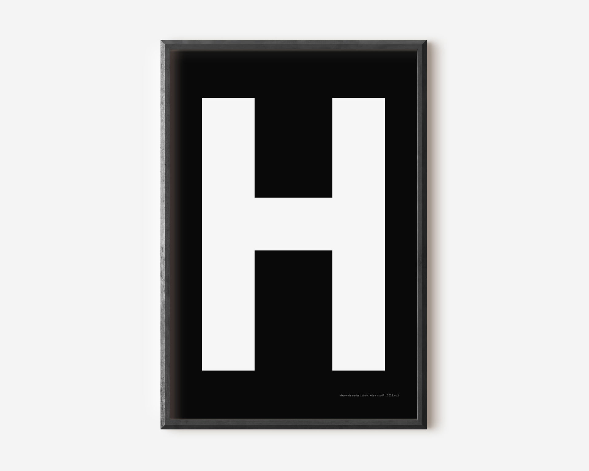 Modern art print with an uppercase white letter H on a black background.