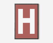 Modern art print with an uppercase white letter H on a Nantucket red background.