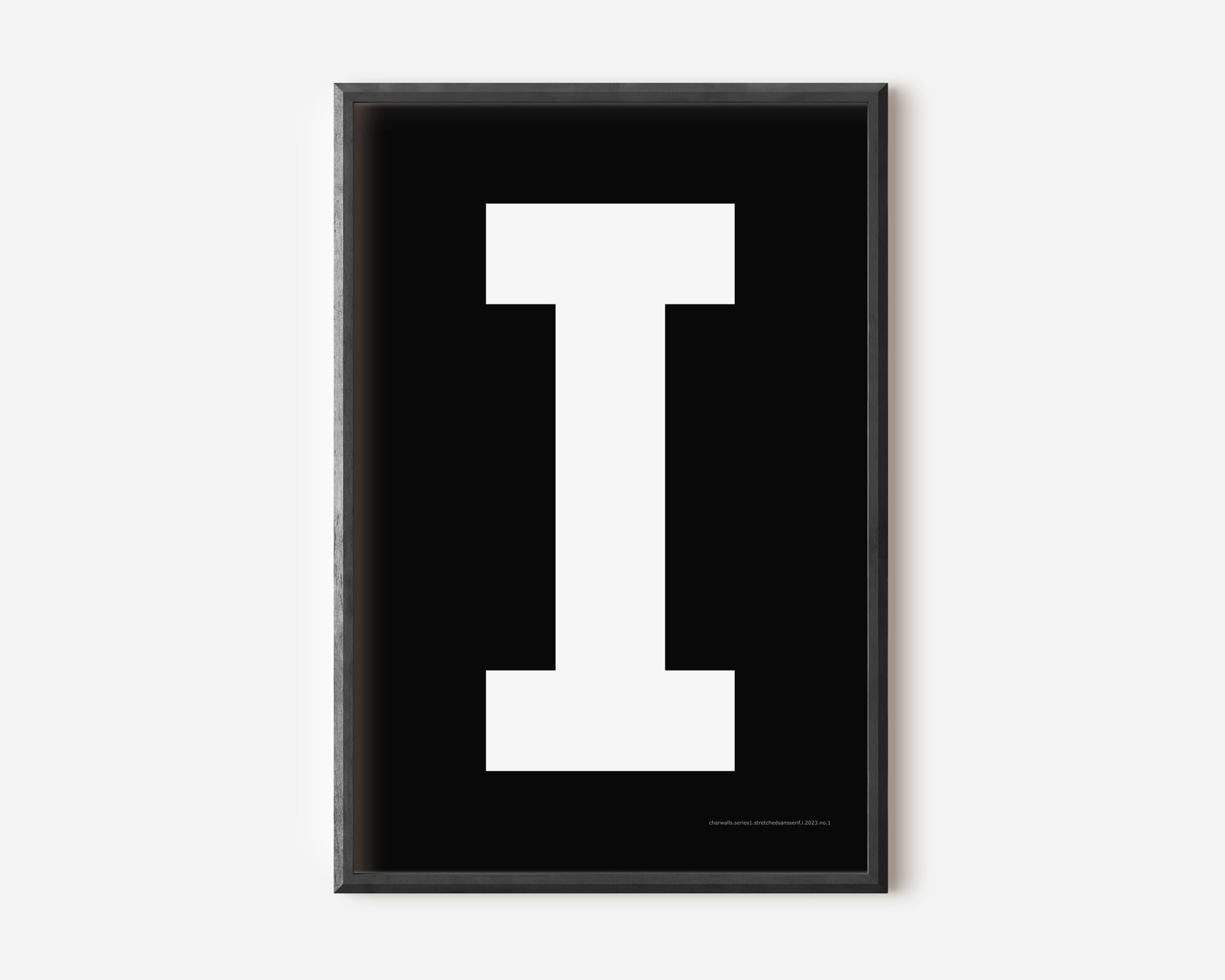 Modern art print with an uppercase white letter I on a black background.