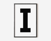 Modern art print with an uppercase black letter I on a white background.