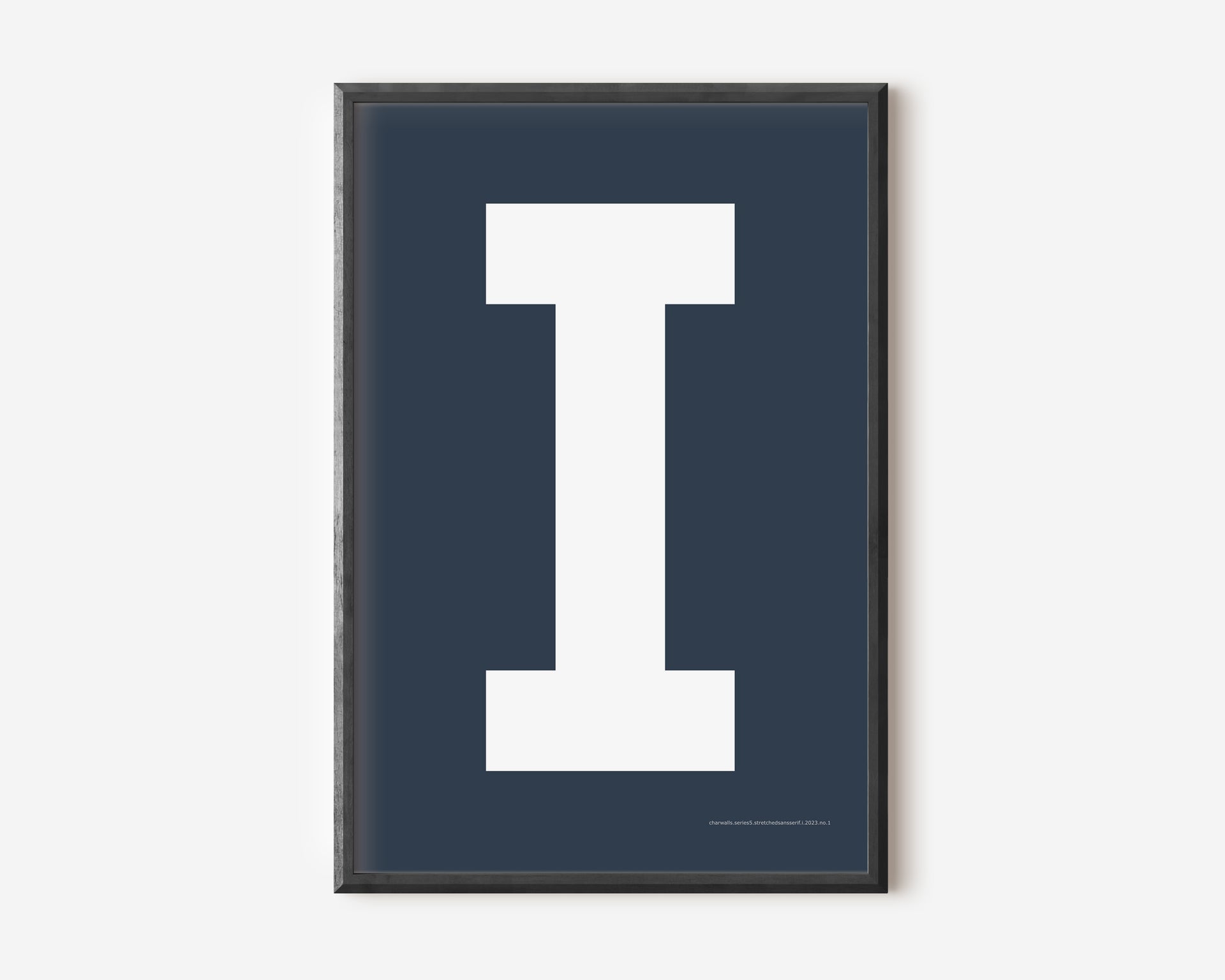 Modern art print with an uppercase white letter I on a navy blue background.