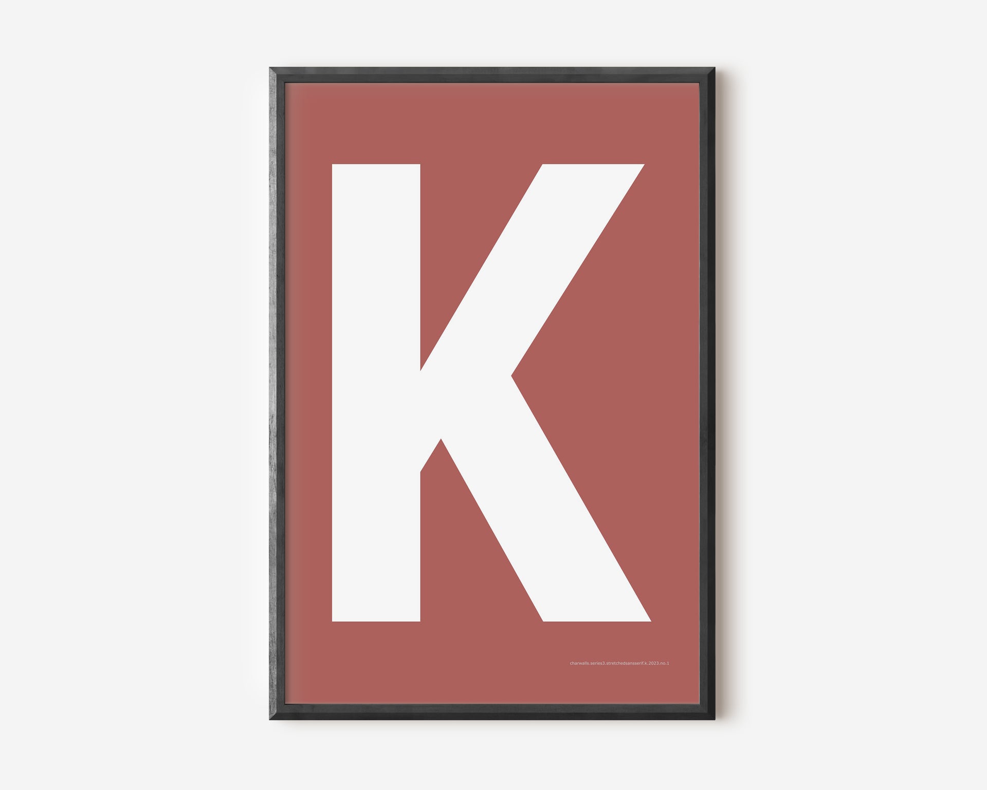 Modern art print with an uppercase white letter K on a Nantucket red background.