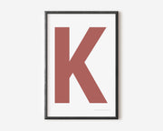 Modern art print with an uppercase Nantucket red letter K on a white background.