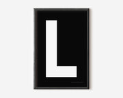 Modern art print with an uppercase white letter L on a black background.