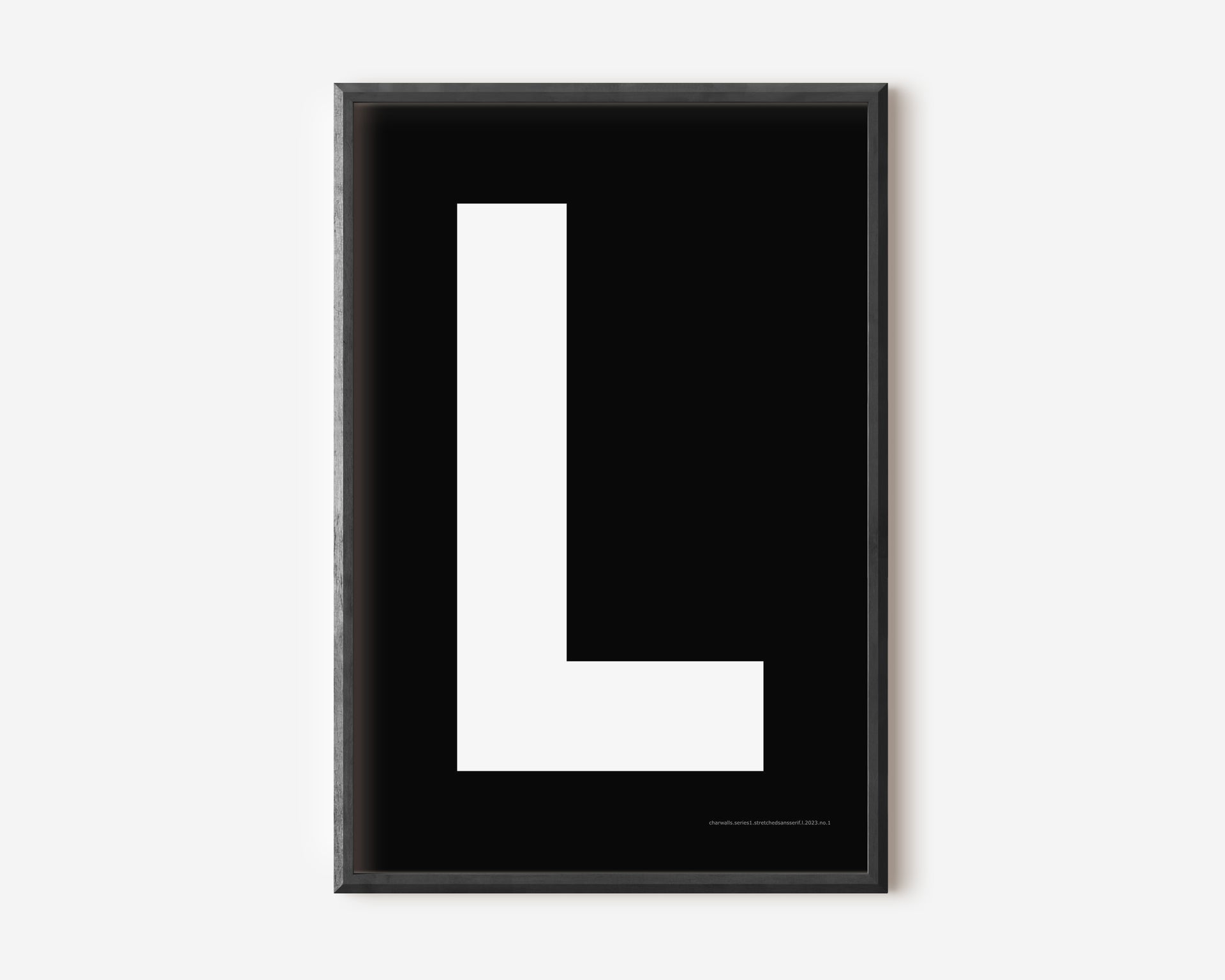 Modern art print with an uppercase white letter L on a black background.
