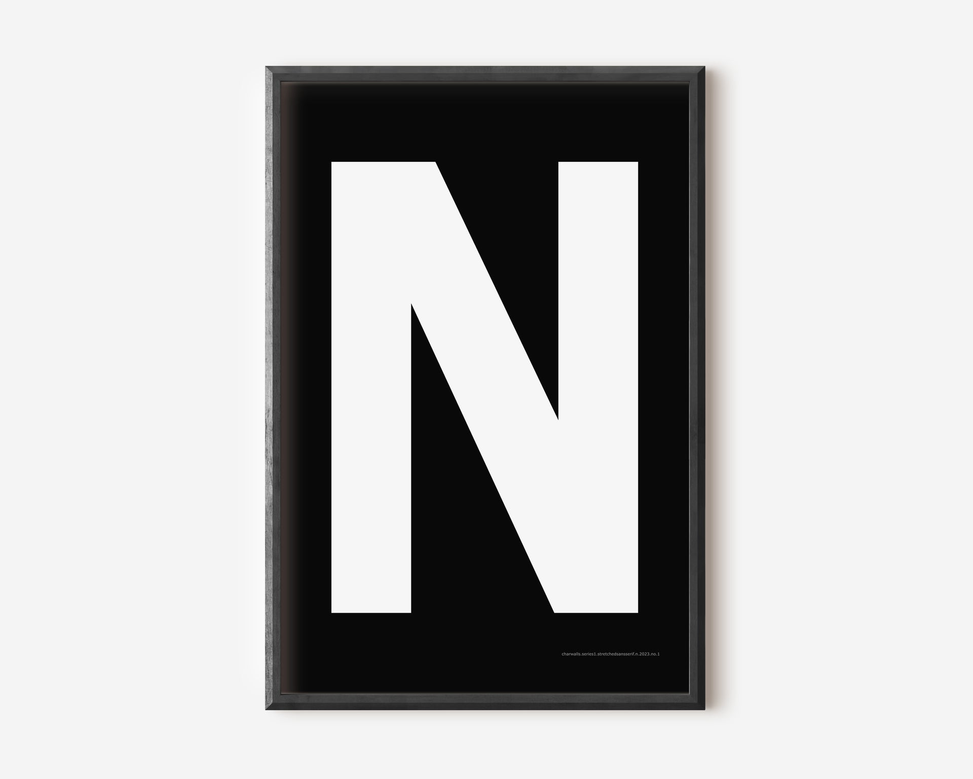 Modern art print with an uppercase white letter N on a black background.