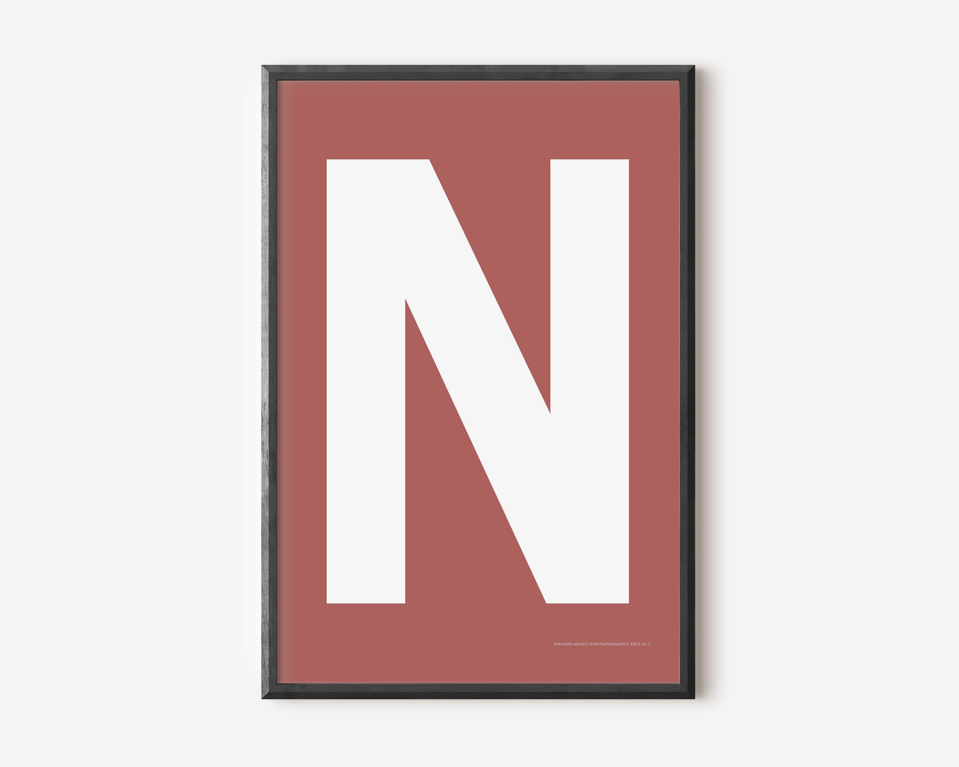 Modern art print with an uppercase white letter N on a Nantucket red background.