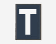 Modern art print with an uppercase white letter T on a navy blue background.