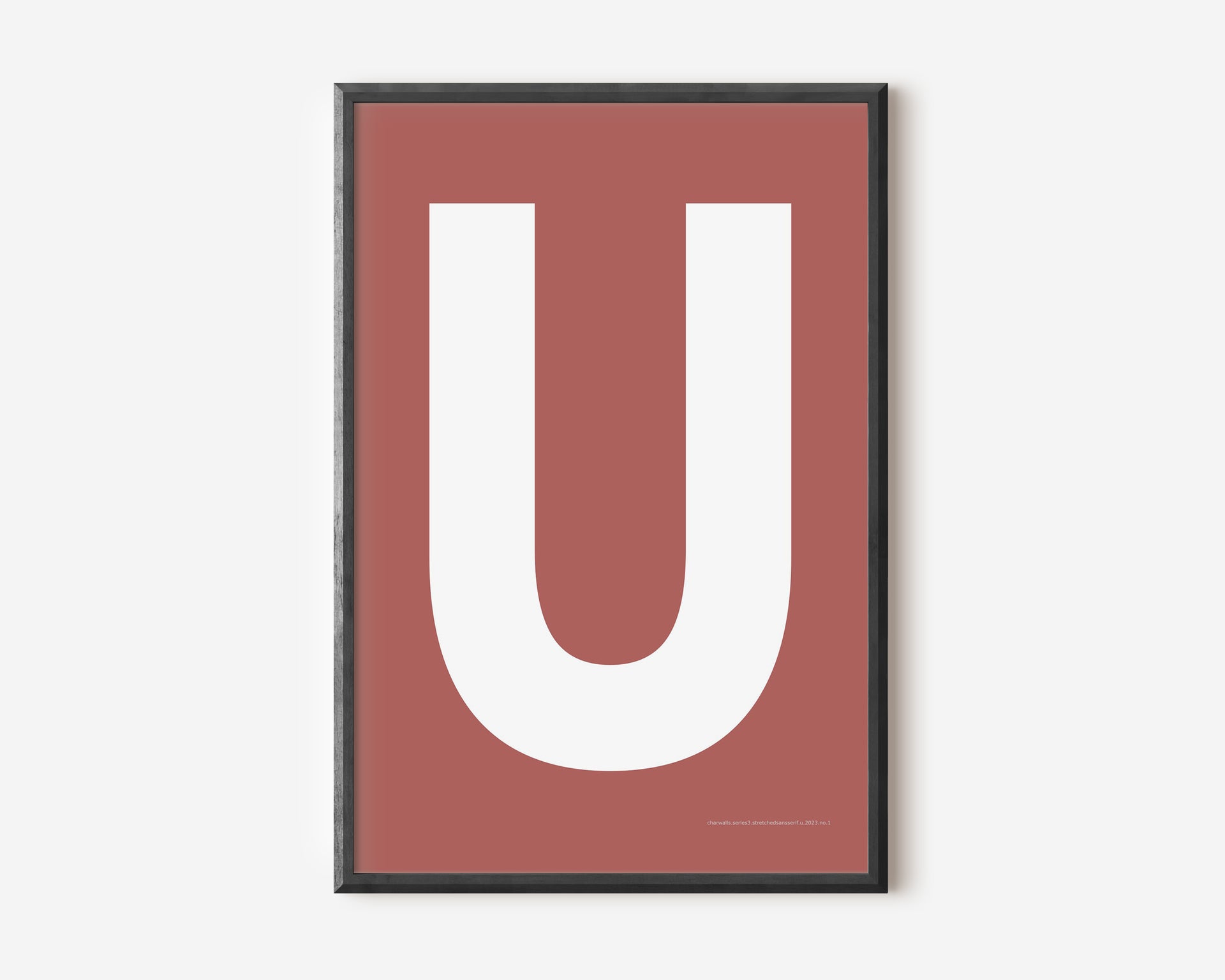 Modern art print with an uppercase white letter U on a Nantucket red background.