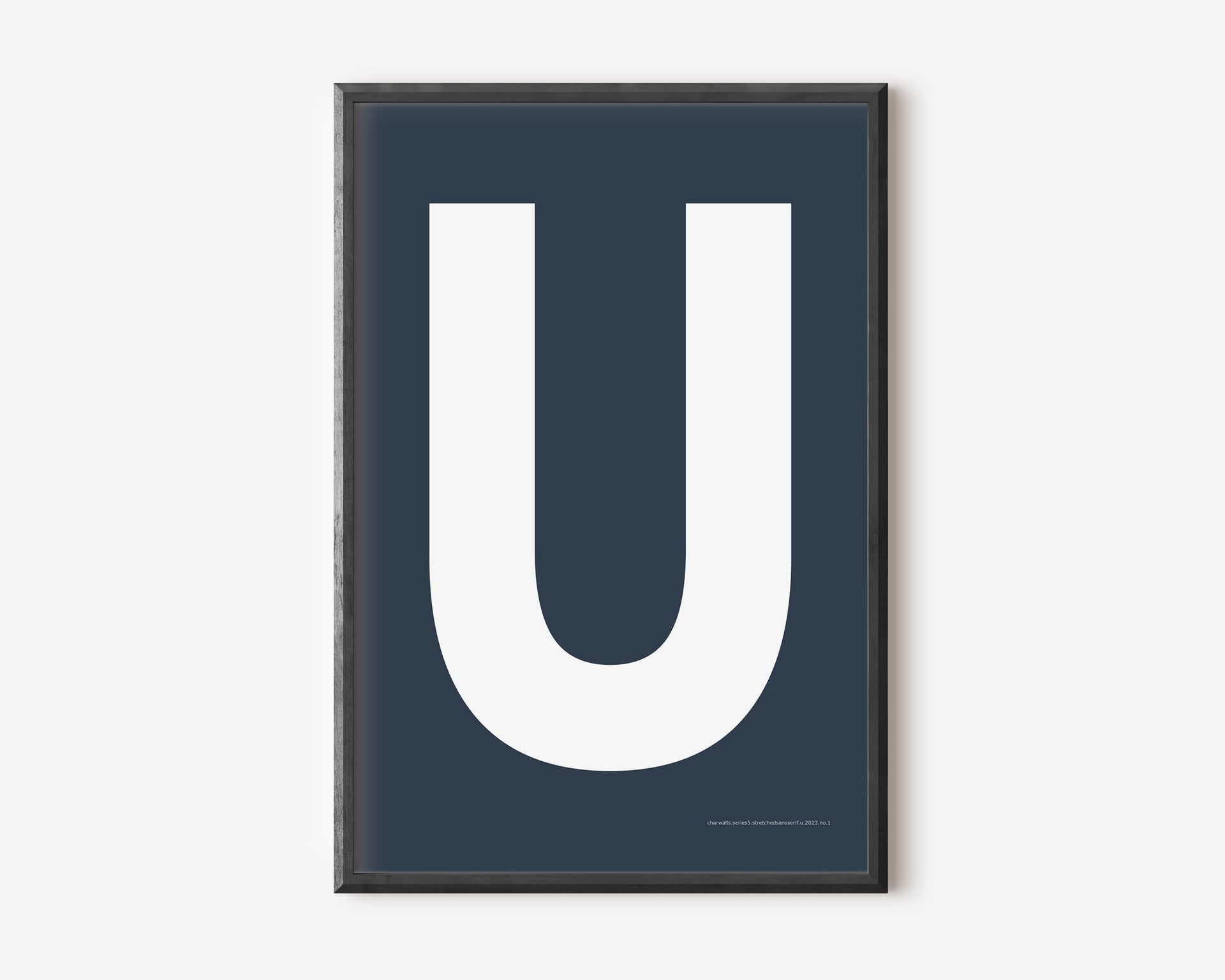 Modern art print with an uppercase white letter U on a navy blue background.