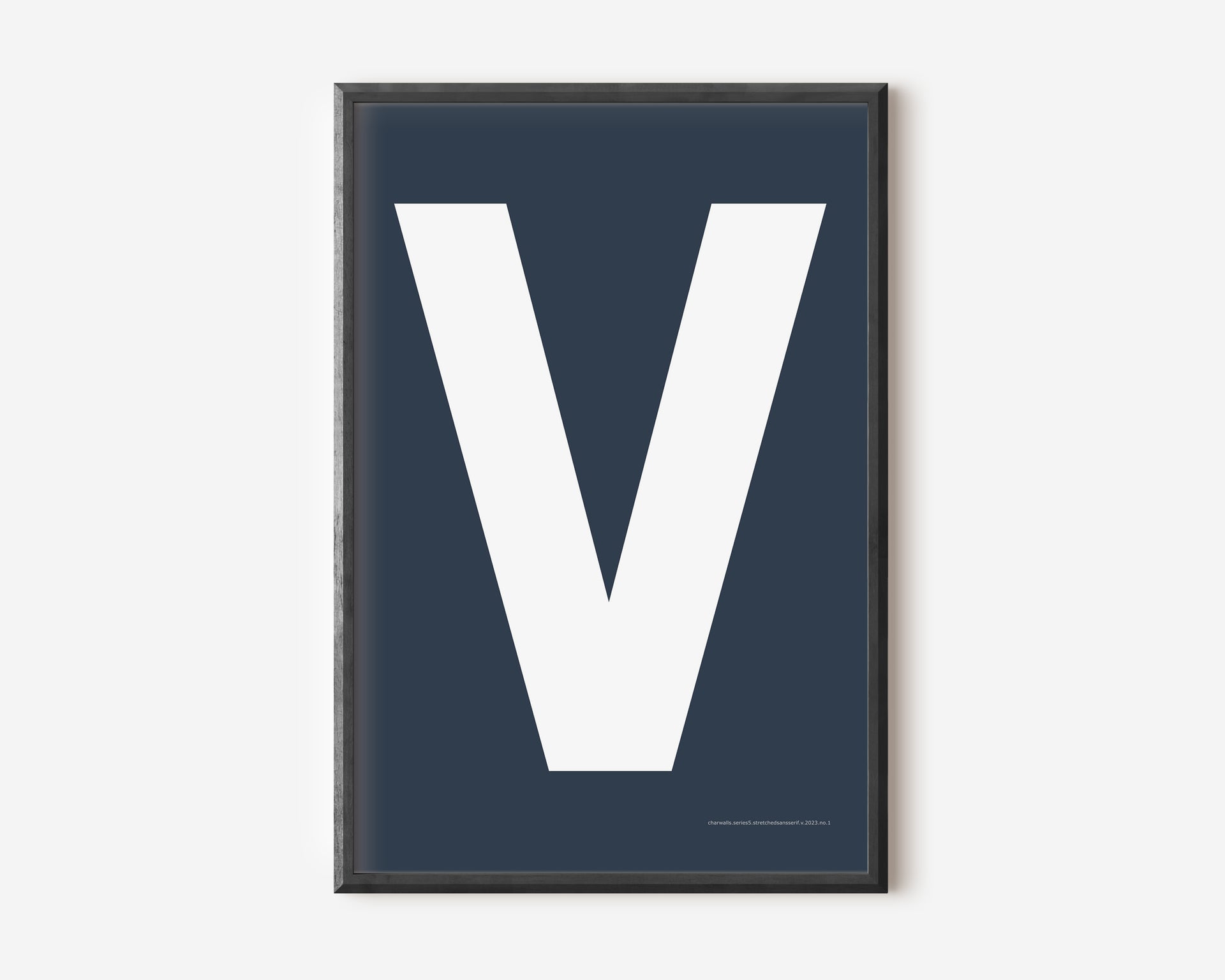 Modern art print with an uppercase white letter V on a navy blue background.