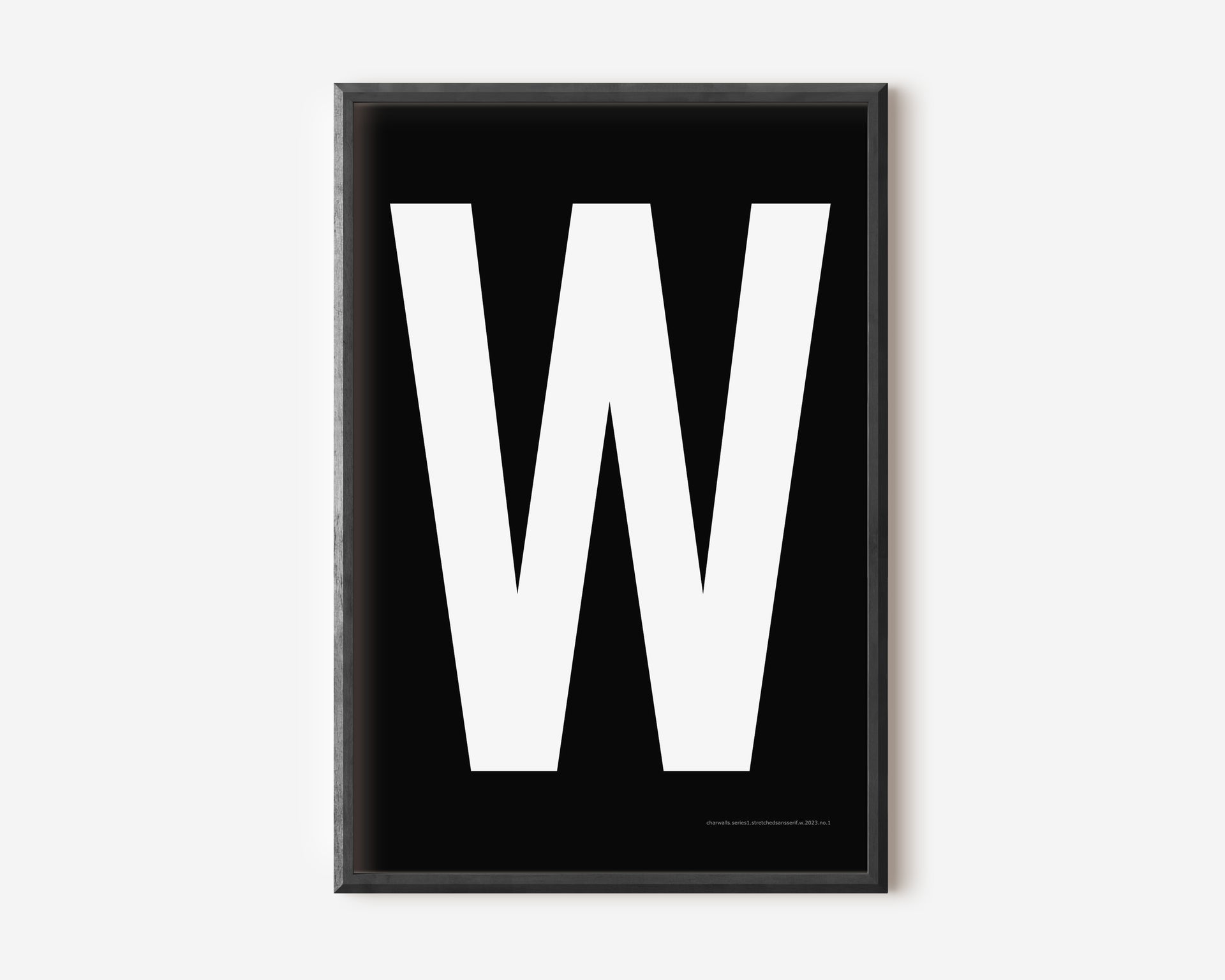 Modern art print with an uppercase white letter W on a black background.