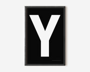 Modern art print with an uppercase white letter Y on a black background.