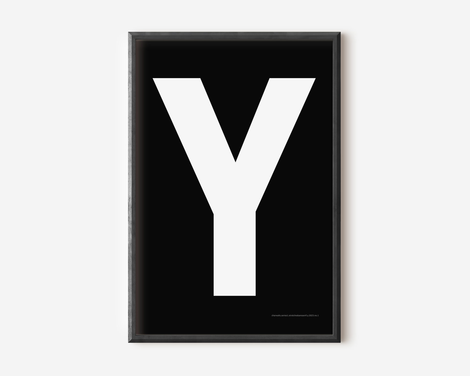Modern art print with an uppercase white letter Y on a black background.