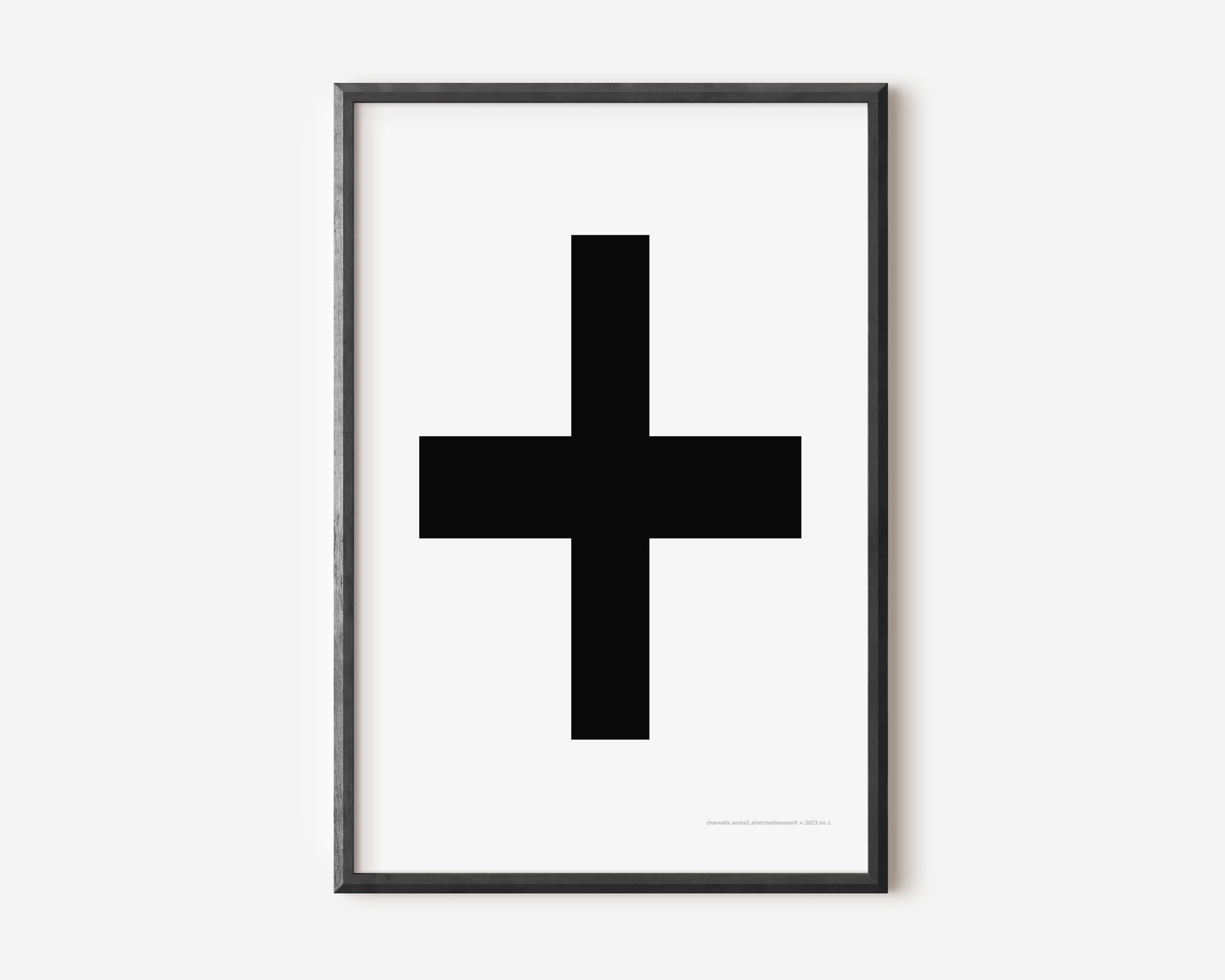 Modern symbol art print with a black plus sign on a white background.