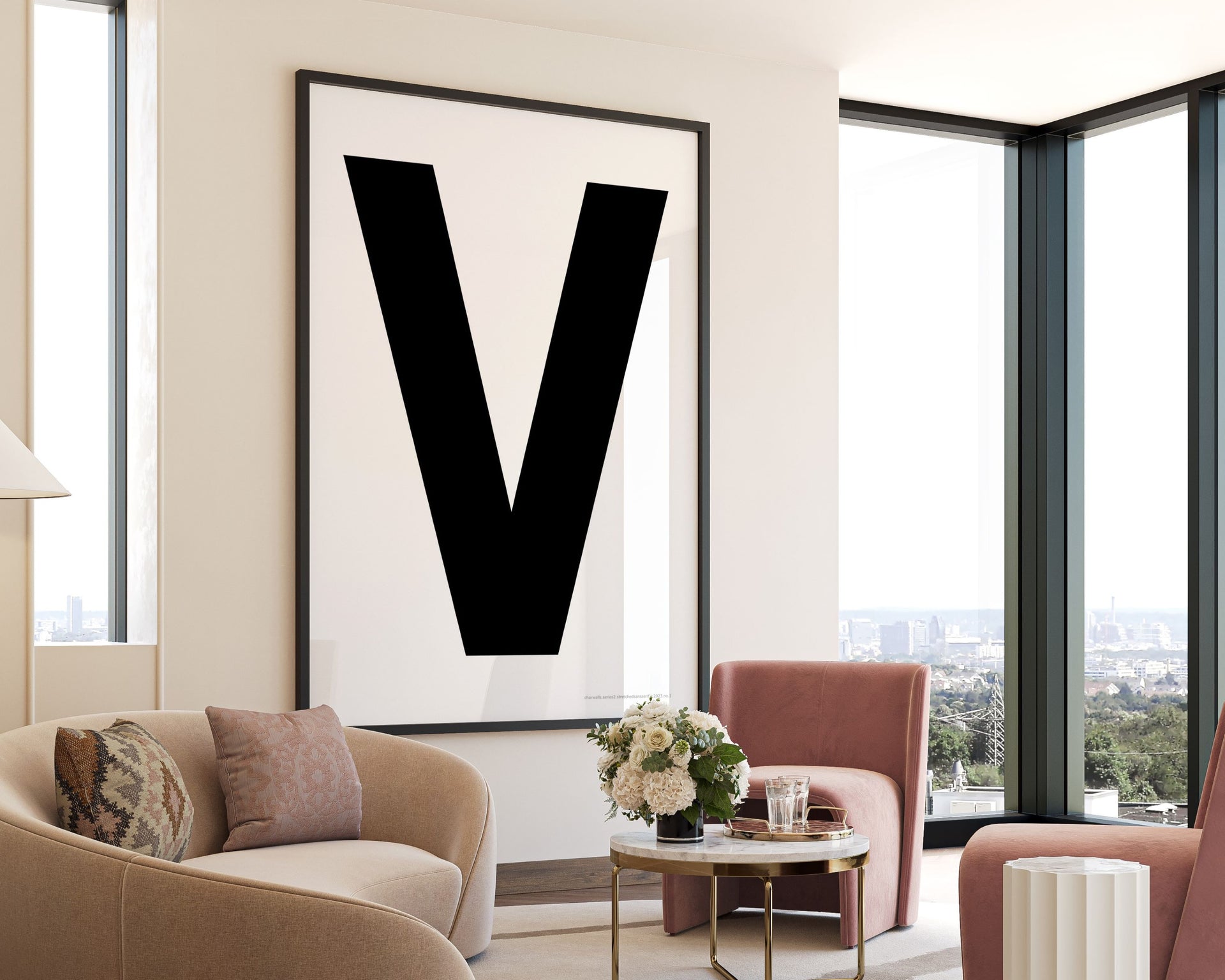 Oversized framed black and white letter V art print hanging in a modern living room.