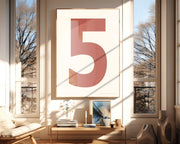 Oversized framed Nantucket red and white number art print featuring the number 5 in a modern living room.
