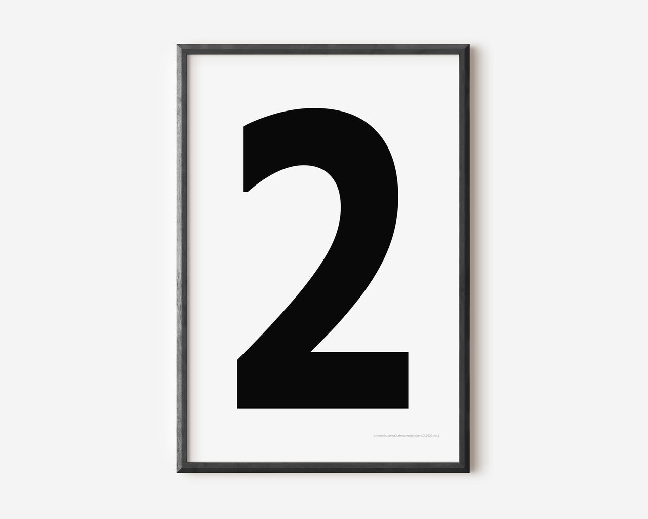Modern number 2 art print with a black two on a white background.