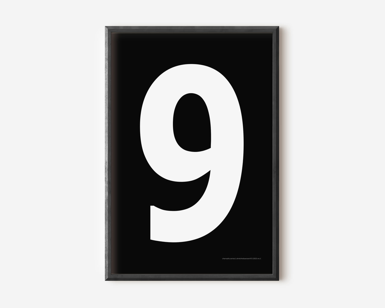 Modern number 9 art print with a white nine on a black background.