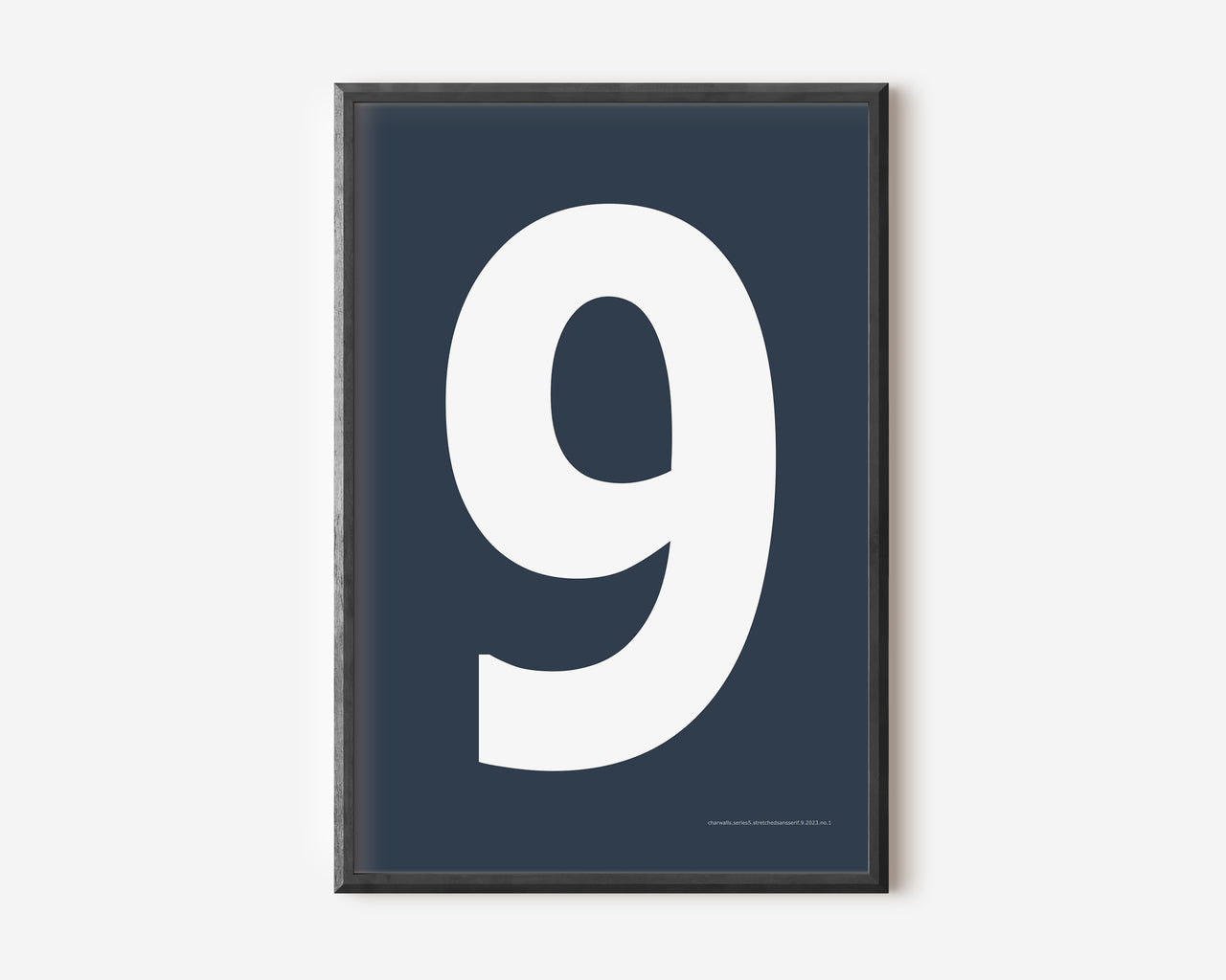 Modern number 9 art print with a white nine on a navy blue background.