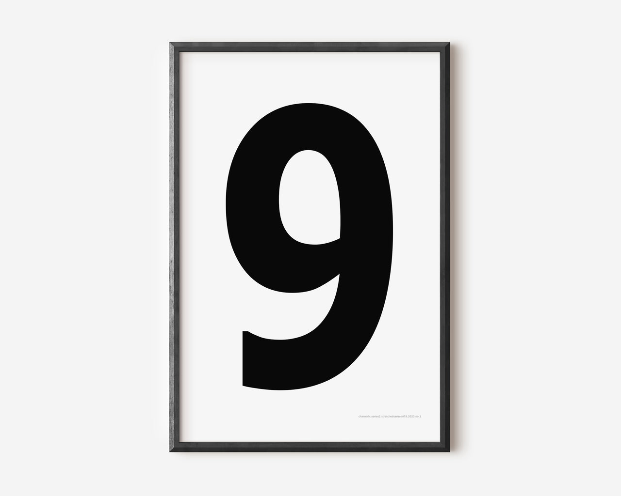 Modern number 9 art print with a black nine on a white background.