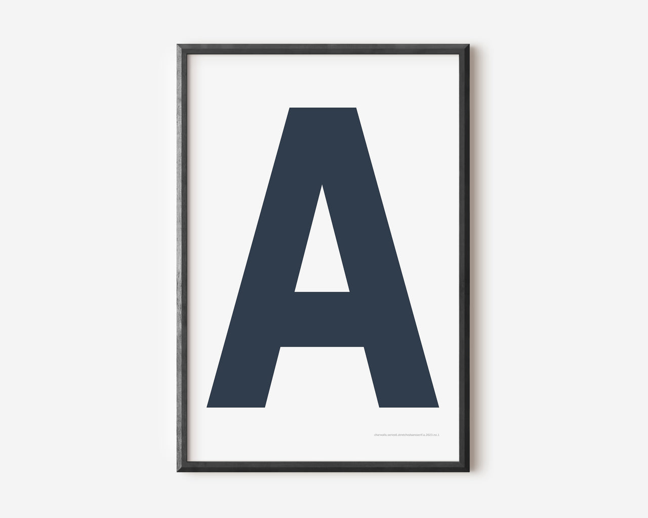 Modern art print with an uppercase navy blue letter A on a white background.