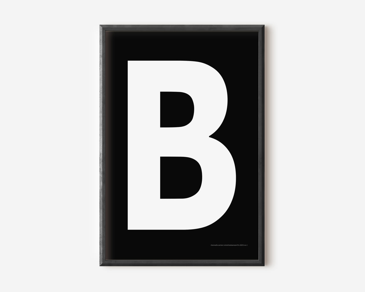 Modern art print with an uppercase white letter B on a black background.