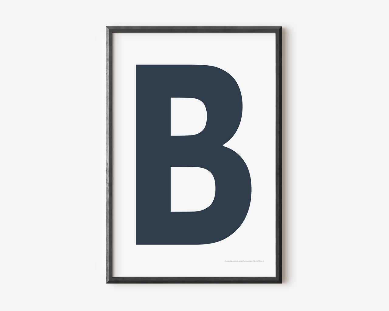 Modern art print with an uppercase navy blue letter B on a white background.