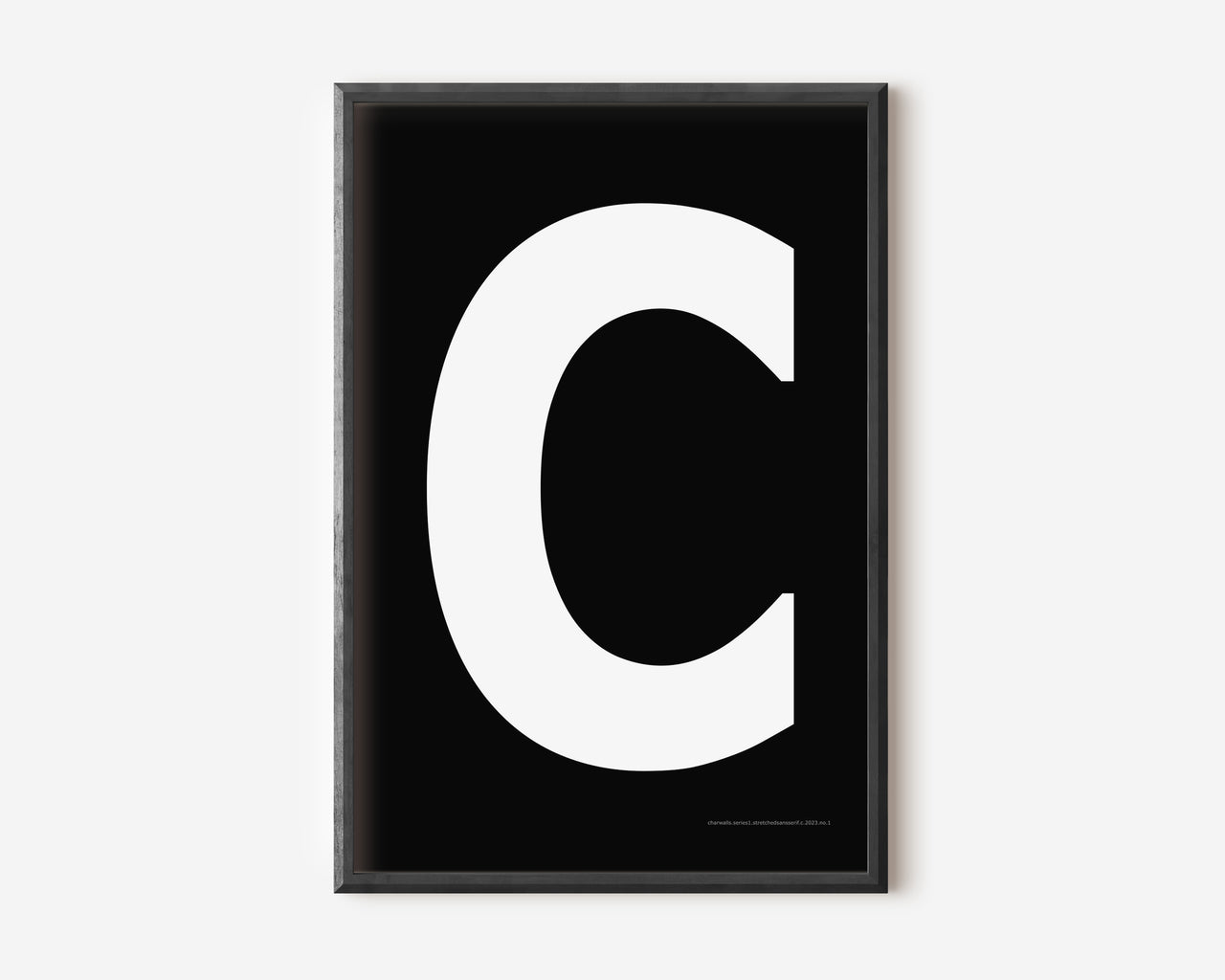Modern art print with an uppercase white letter C on a black background.