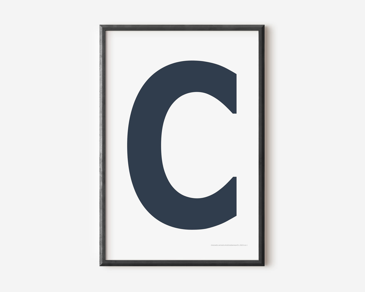 Modern art print with an uppercase navy blue letter C on a white background.