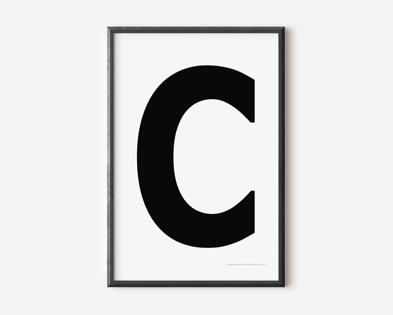 Modern art print with an uppercase black letter C on a white background.