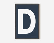 Modern art print with an uppercase white letter D on a navy blue background.