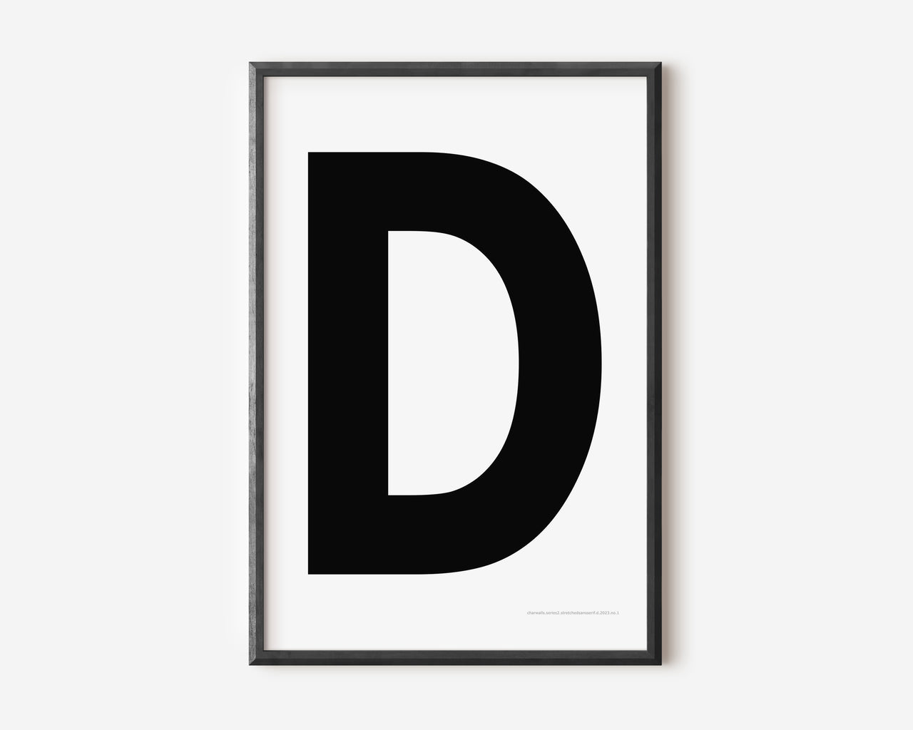 Modern art print with an uppercase black letter D on a white background.