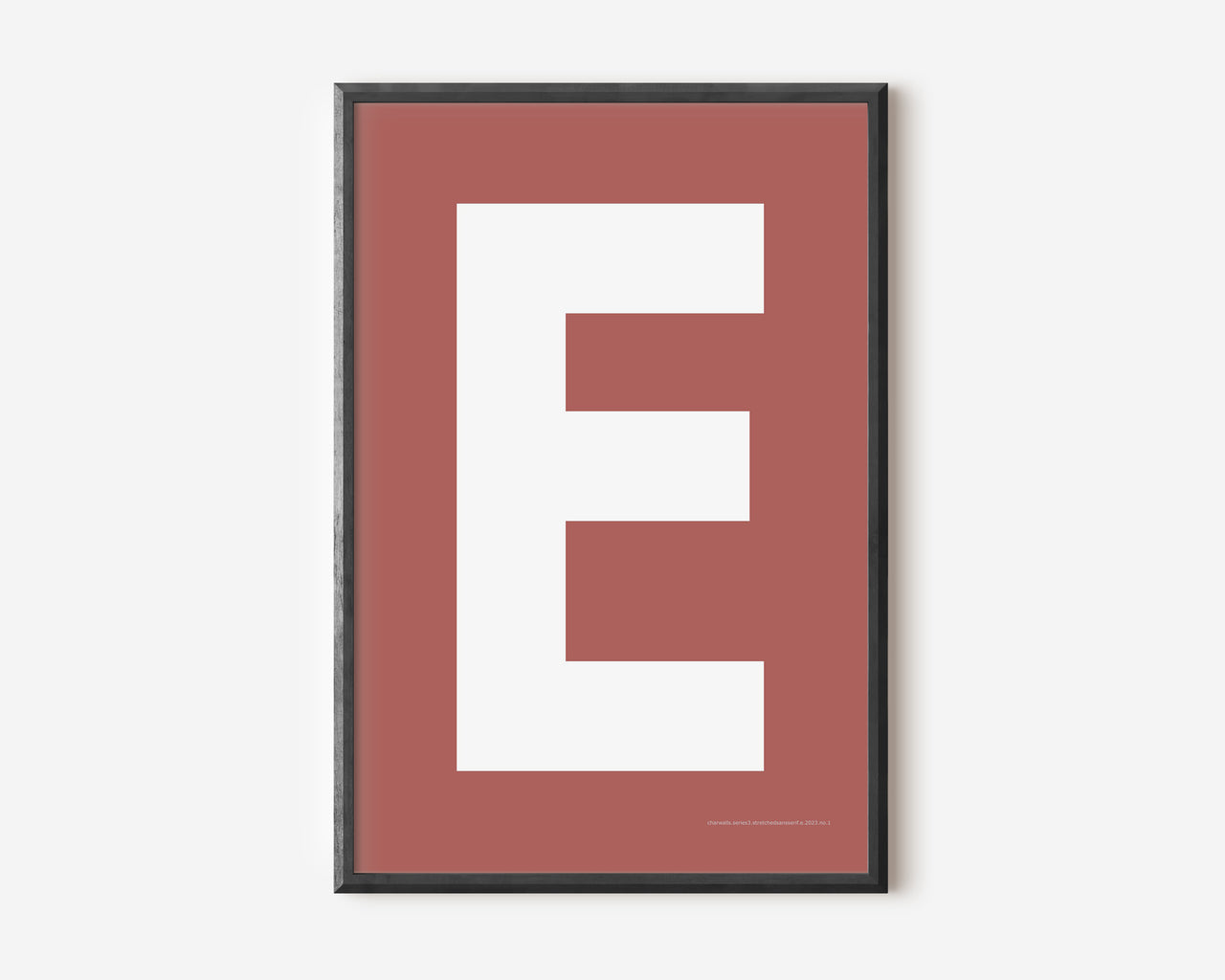 Modern art print with an uppercase white letter E on a Nantucket red background.