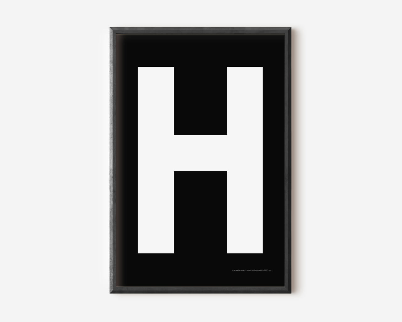 Modern art print with an uppercase white letter H on a black background.