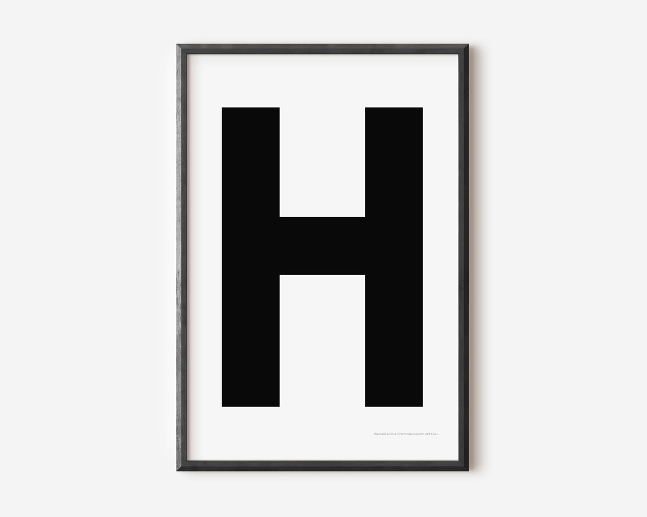 Modern art print with an uppercase black letter H on a white background.