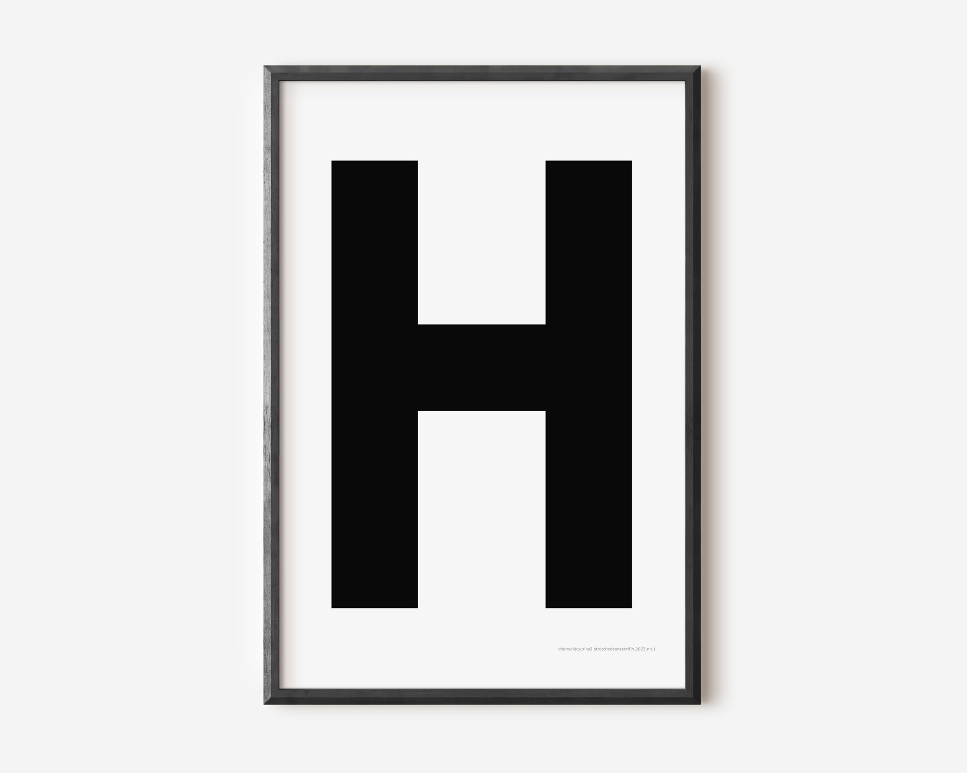 Modern art print with an uppercase black letter H on a white background.