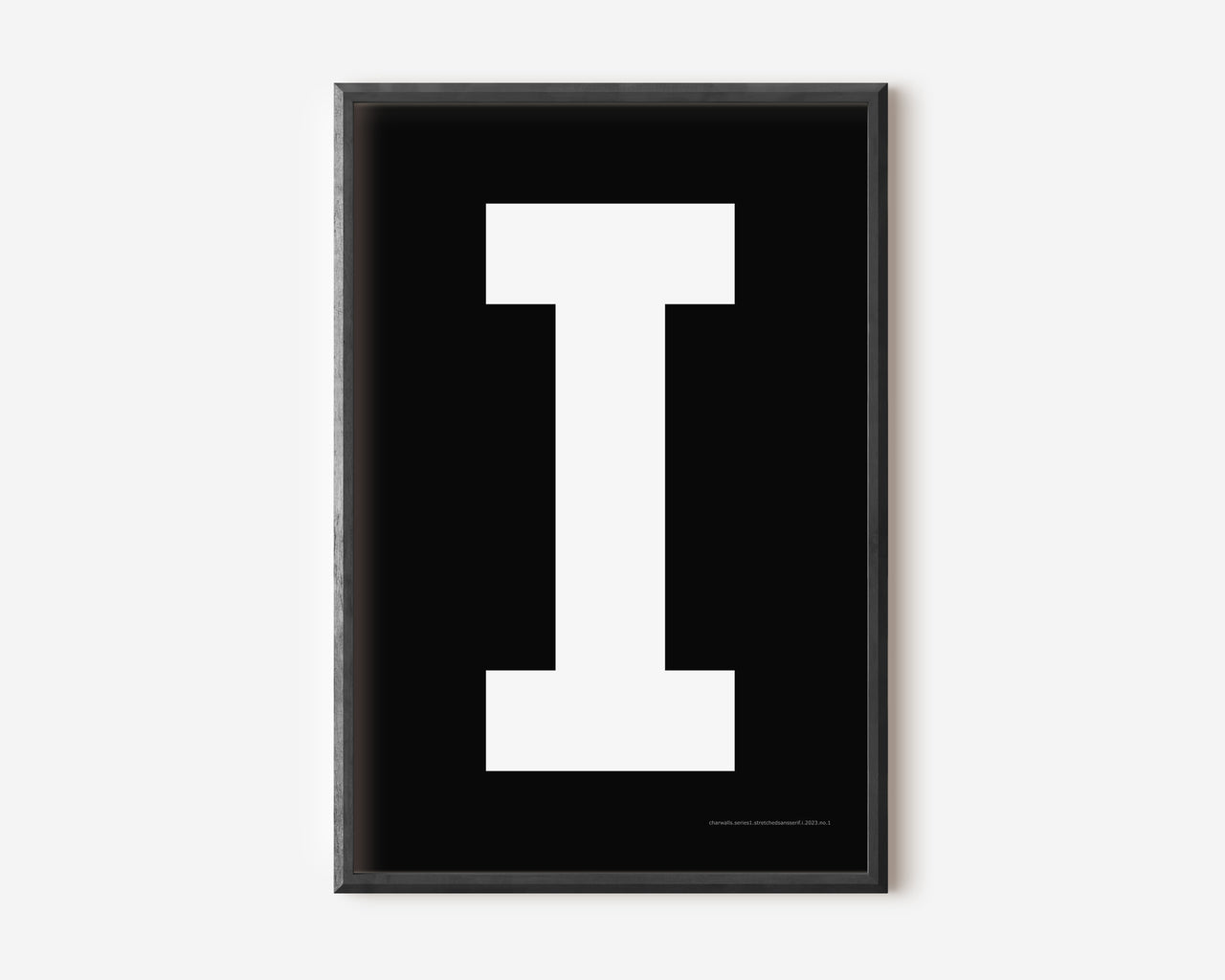 Modern art print with an uppercase white letter I on a black background.