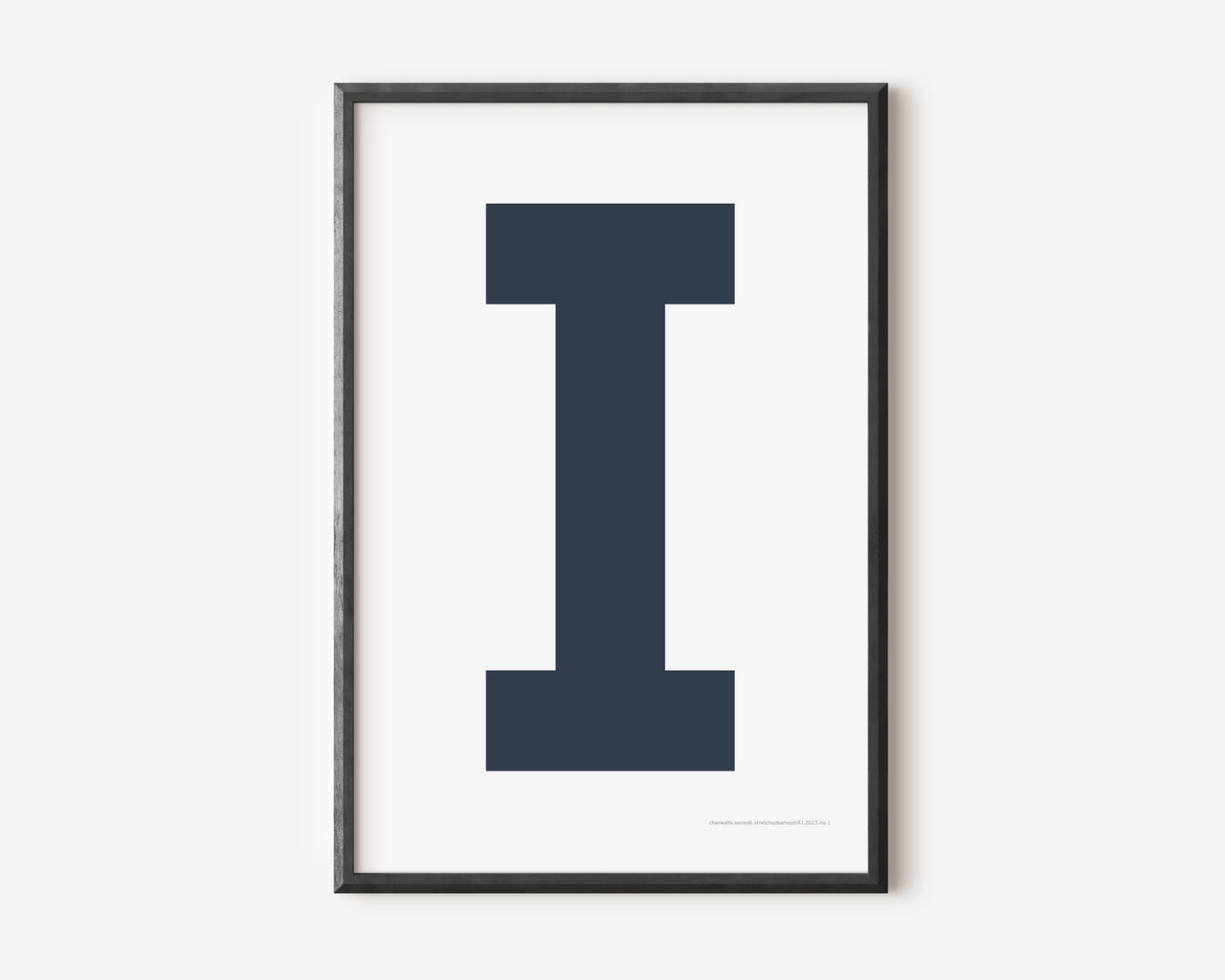 Modern art print with an uppercase navy blue letter I on a white background.