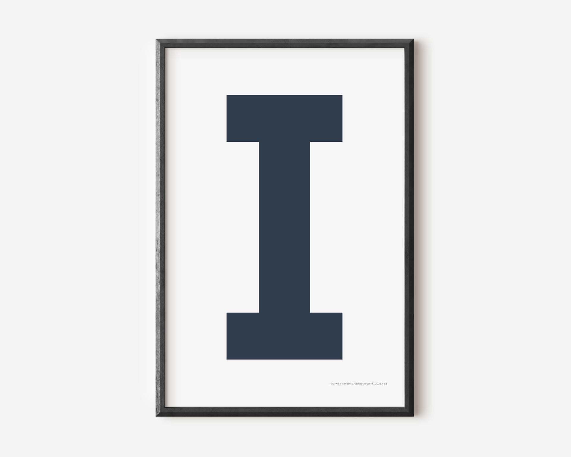 Modern art print with an uppercase navy blue letter I on a white background.