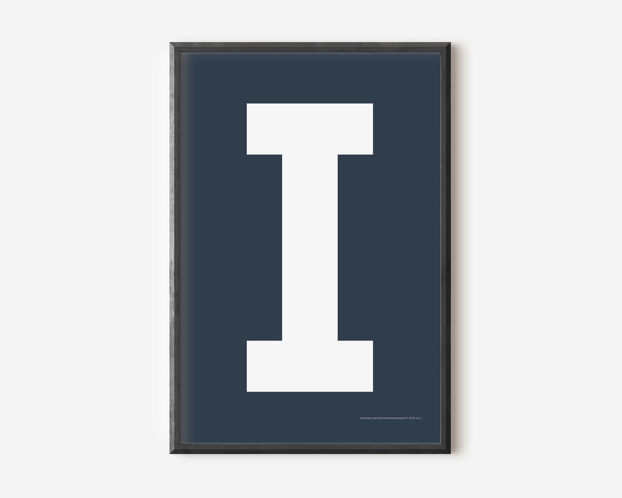 Modern art print with an uppercase white letter I on a navy blue background.